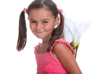 Girl hiding flowers behind her back clipart