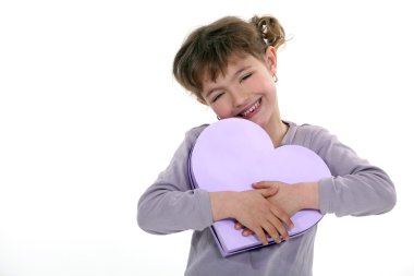 Girl holding a heart-shaped box clipart