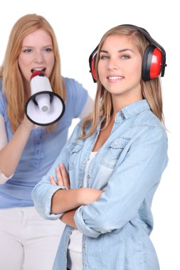 Teenager shouting in loud speaker clipart