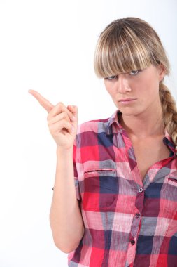 Scolding young woman wagging her finger clipart