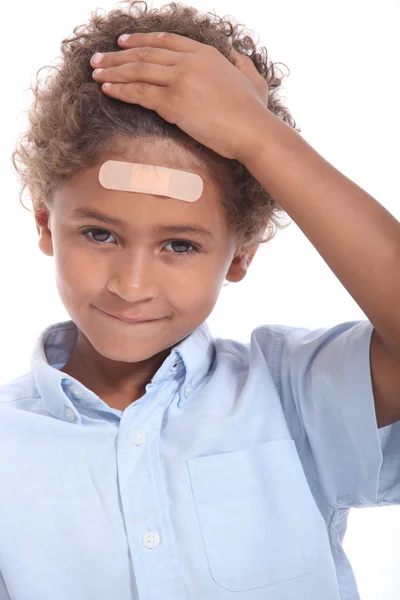 Little boy with plaster — Stock Photo, Image