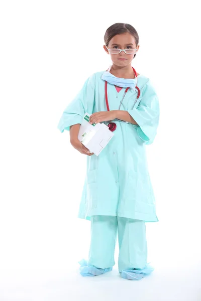 Klein meisje gekleed in uniform verpleegkundigen — Stockfoto