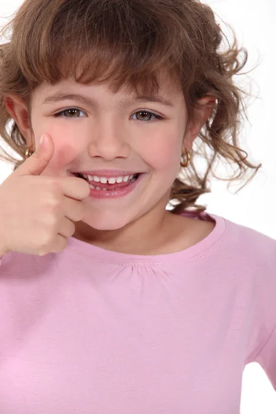 Dziewczynka podając kciuki up — Zdjęcie stockowe