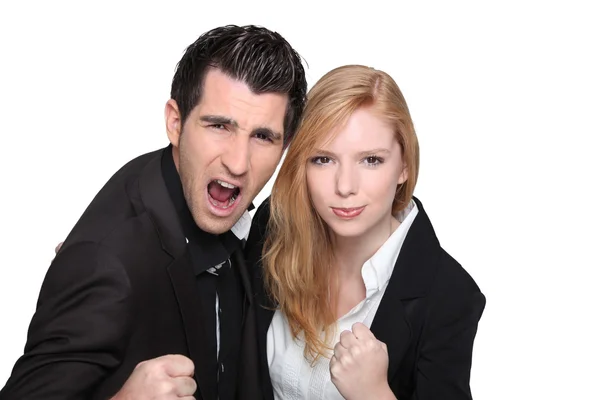 Business couple with their fists in the air — Stock Photo, Image