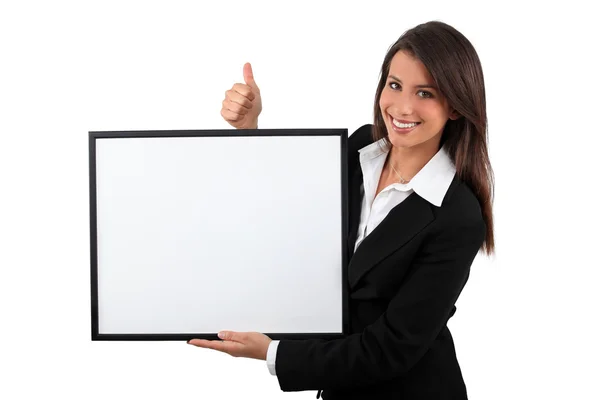 Young woman showing board — Stock Photo, Image