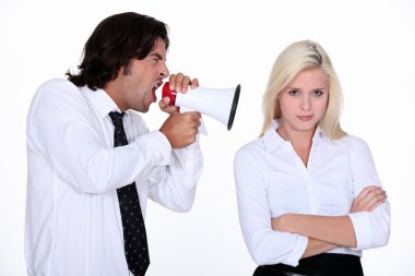 Man shouting into a woman's ear clipart