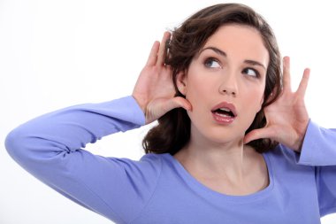 Woman listening something carefully clipart