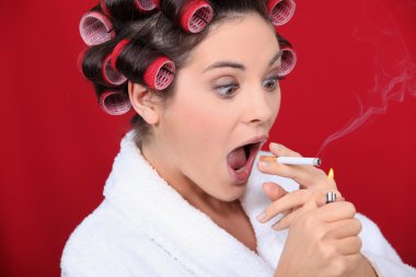 Woman with curlers and lit cigarette clipart