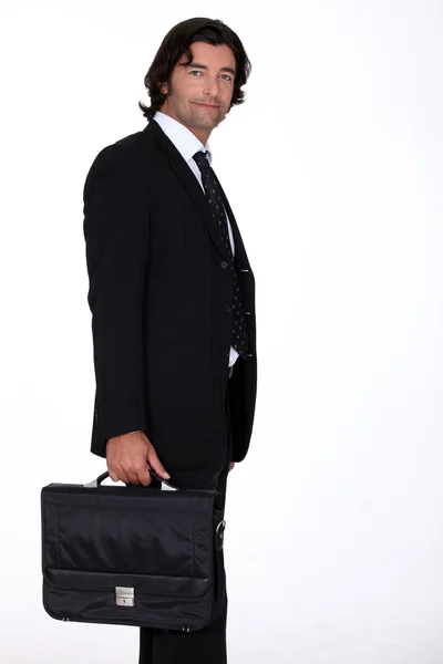 Retrato de un hombre de negocios que lleva un maletín — Foto de Stock
