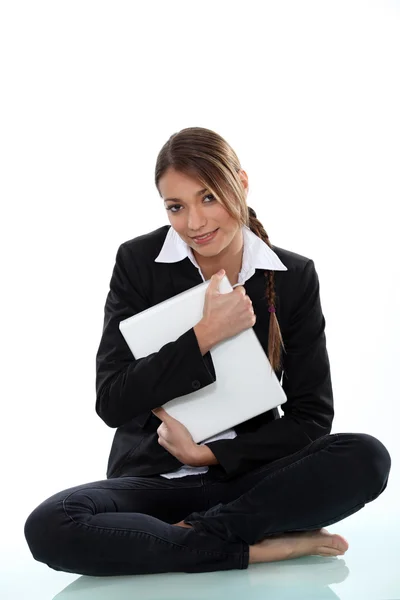 A cute businesswoman hugging a file. — Stock Photo, Image