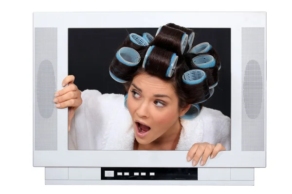 Woman escaping from television set — Stock Photo, Image