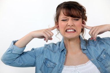 Woman covering her ears clipart