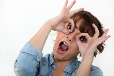 Young woman making a funny face clipart