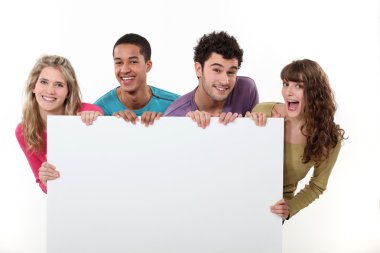 Group of friends holding a blank poster clipart