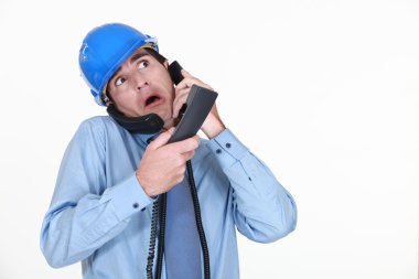 Man juggling several phone calls clipart