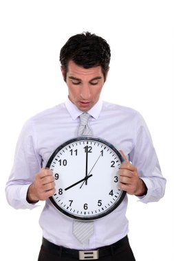 Businessman with a clock clipart