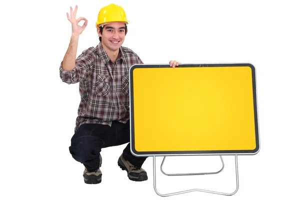 Workman with empty road sign for message — Stock Photo, Image