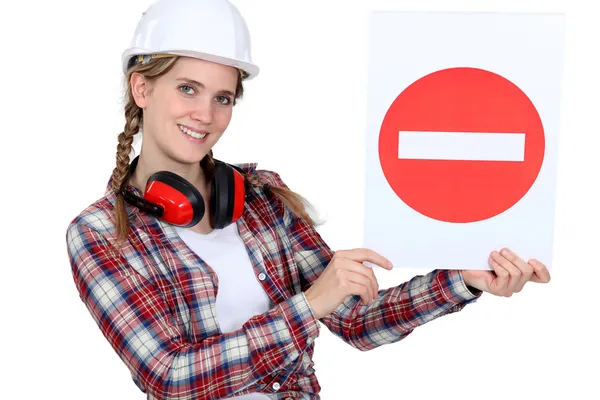 Traffic guard holding a no entry sign — Stock Photo, Image