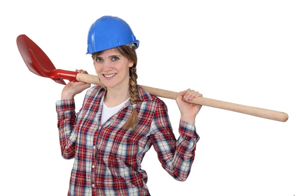 A female construction worker with a shovel. — Stock Photo, Image