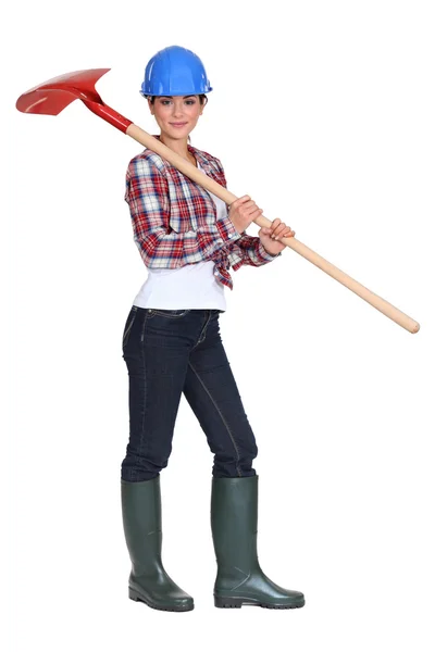 Labourer carrying a spade — Stock Photo, Image