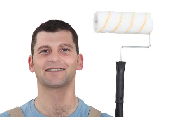 Decorator using roller to paint — Stock Photo, Image