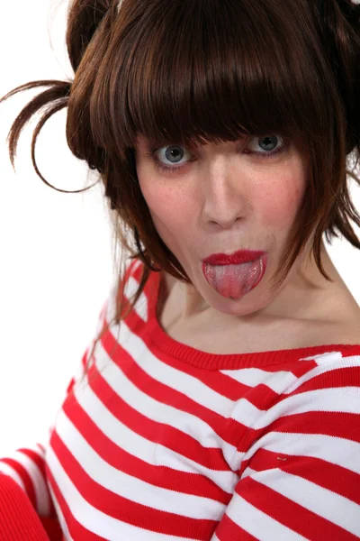 Woman sticking out her tongue — Stock Photo, Image
