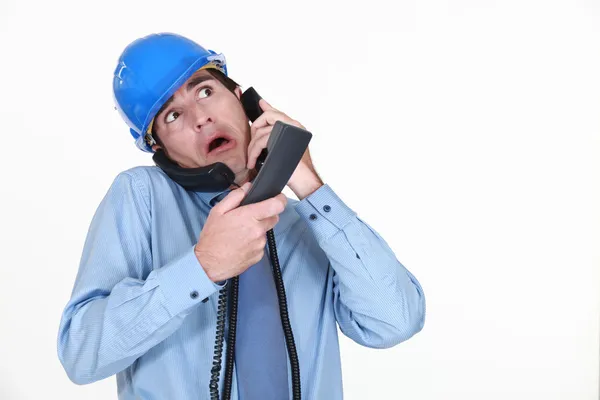 Man juggling several phone calls — Stock Photo, Image