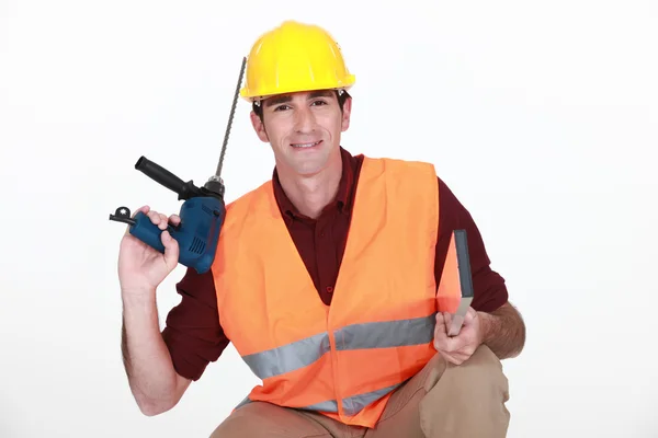 Trabajador de la construcción con un taladro de mampostería —  Fotos de Stock