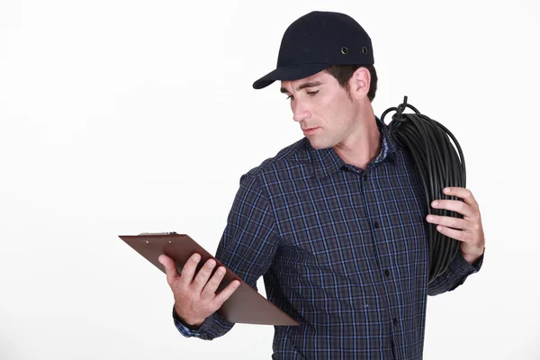 Electrician holding clipboard — Stock Photo, Image