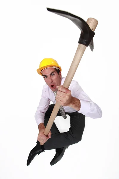 Angry architect sat with pick-ax — Stock Photo, Image