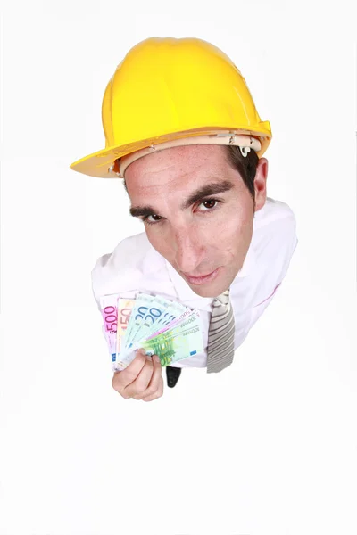 Homem de chapéu duro com dinheiro — Fotografia de Stock