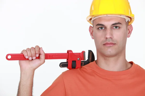 Man with an adjustable wrench — Stock Photo, Image