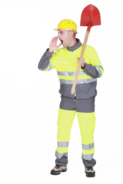 Manual worker with shovel shouting — Stock Photo, Image