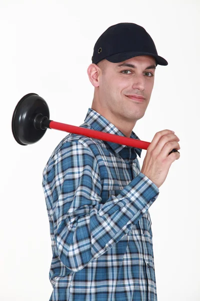 Smiling plumber holding ventouse — Stock Photo, Image