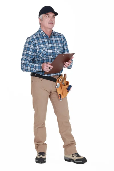 Carpenter with a clipboard — Stock Photo, Image
