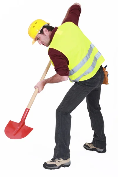A male construction worker digging. — Stock Photo, Image