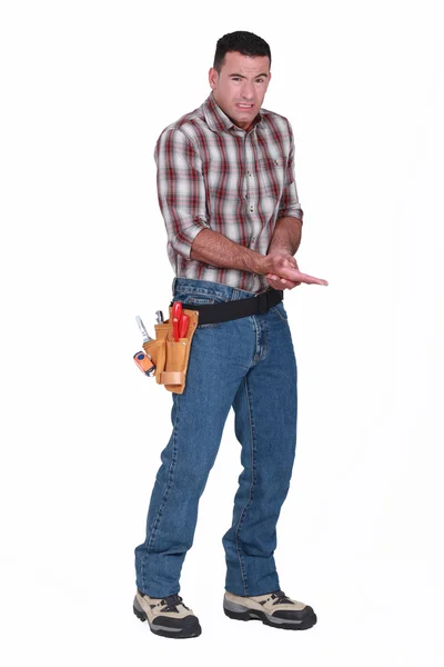A handyman who hurt his hand. — Stock Photo, Image