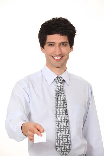 Smiling businessman offering his business card — Stock Photo, Image