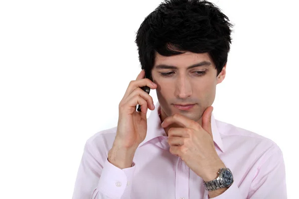 A pensive businessman over the phone. — Stock Photo, Image