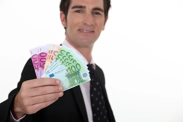 Man with a range of tickets in hand — Stock Photo, Image