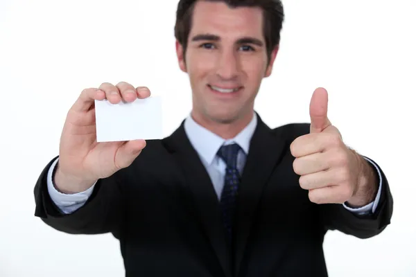 Businessman advertising his company via business card — Stock Photo, Image
