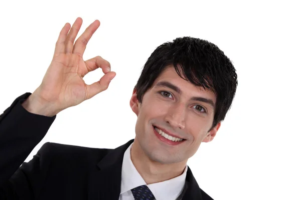 A businessman gesturing an ok sign. — Stock Photo, Image