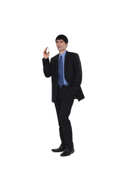 Businessman holding his mobile phone — Stock Photo, Image