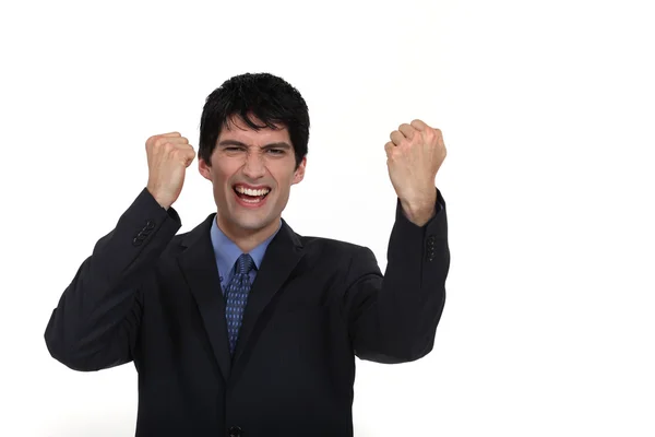 A businessman gesturing victory. — Stock Photo, Image