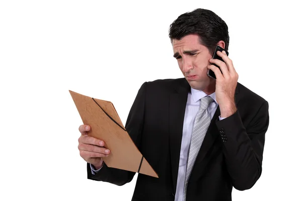 A dubious businessman over the phone. — Stock Photo, Image