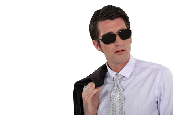 Homem de negócios usando óculos escuros — Fotografia de Stock