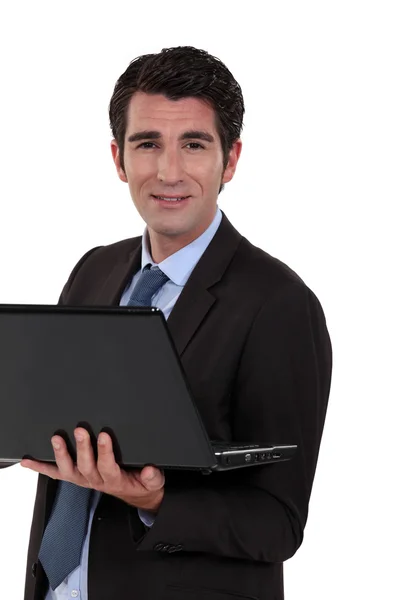Executive med dator i handen — Stockfoto
