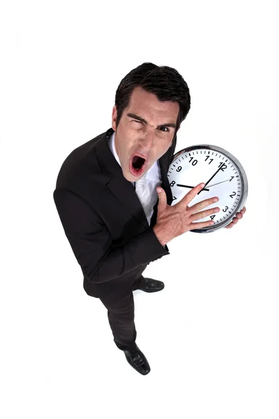 Hombre gritando con el reloj en la mano — Foto de Stock