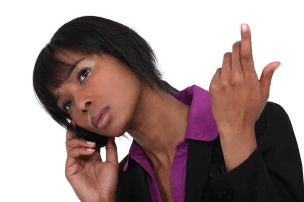 Afro-American businesswoman talking on her cell — Stock Photo, Image
