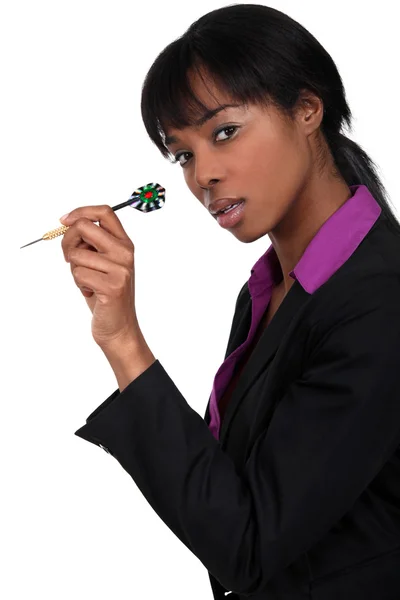 Businesswoman holding dart — Stock Photo, Image